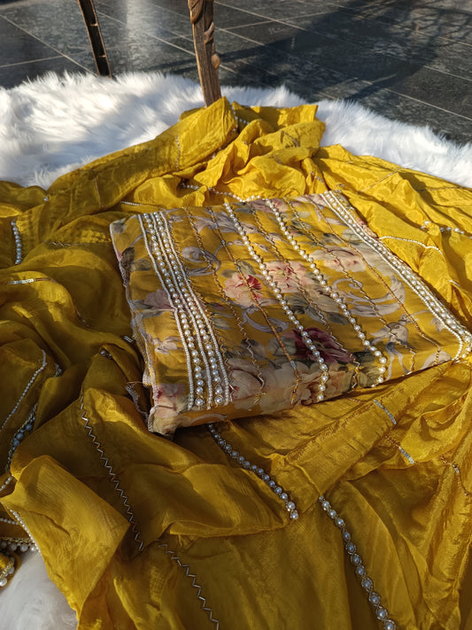 Detailed view of handcrafted embellishments on a Viscos Organza suit with a soft lustrous base