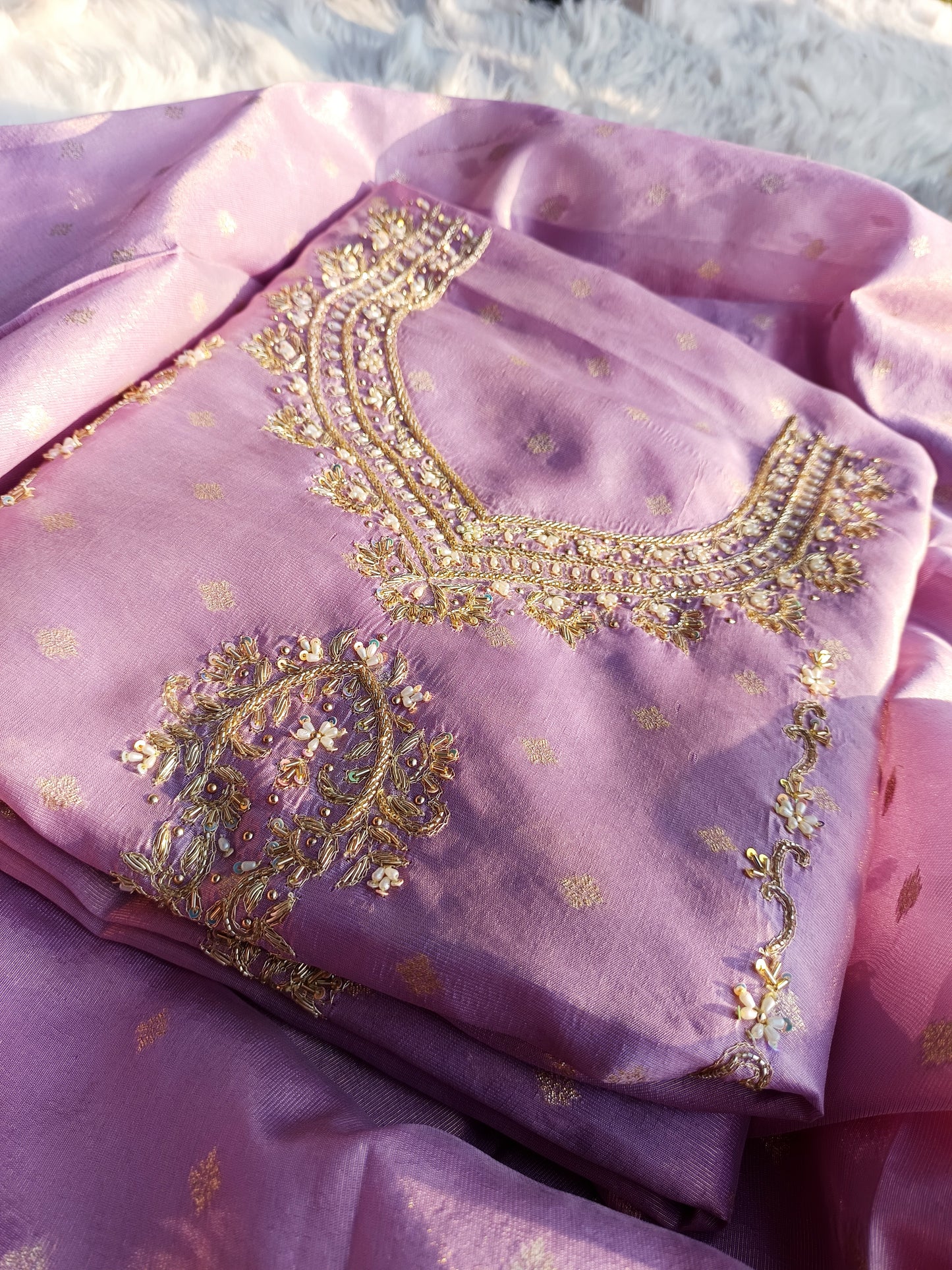 Rear view of pure tissue silk suit showing subtle detailing and graceful silhouette.