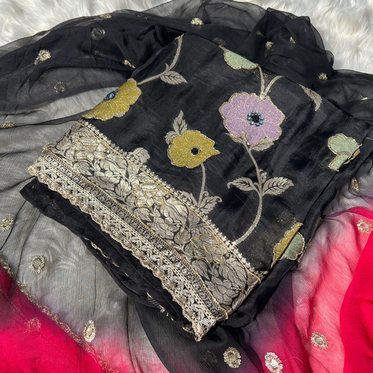 Elevate your ethnic charm with this elegant black Banarasi georgette suit, featuring rich weaving and luxurious drape.