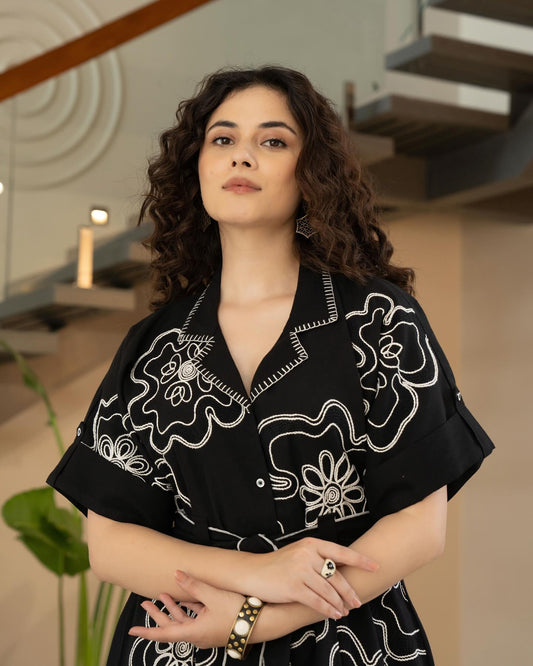 Woman Wearing Black Printed Flared Ethnic Dress With Shirt Collar Front View