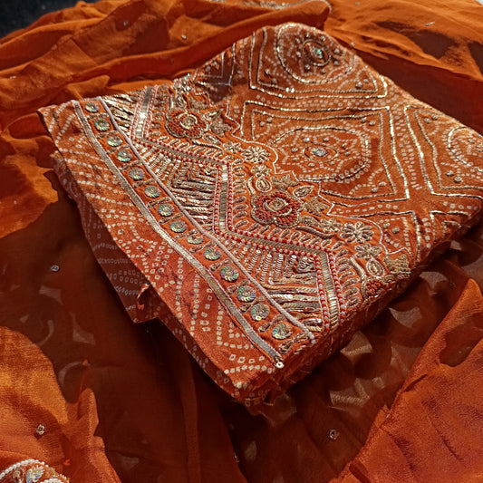 Elegant Bandhani silk suit featuring traditional tie-dye patterns and rich texture.