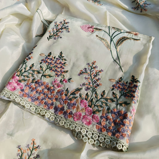 Graceful organza silk embroidery suit featuring intricate floral patterns and lightweight texture