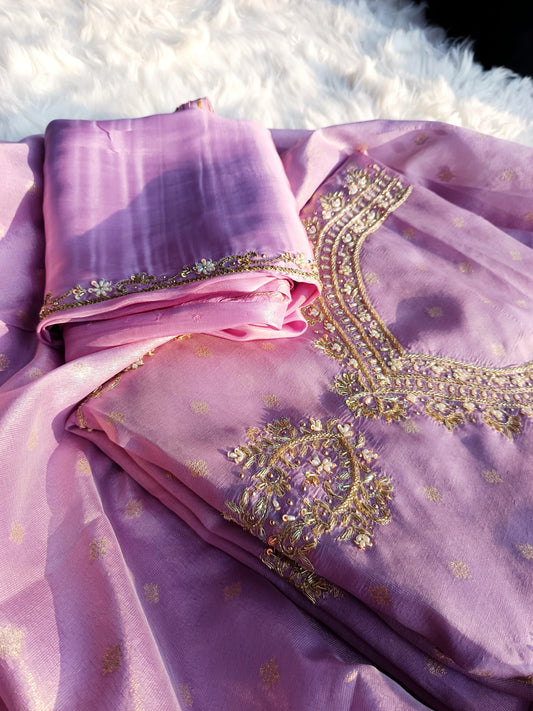 Elegant handwork suit made from tissue silk, paired with coordinated dupatta.