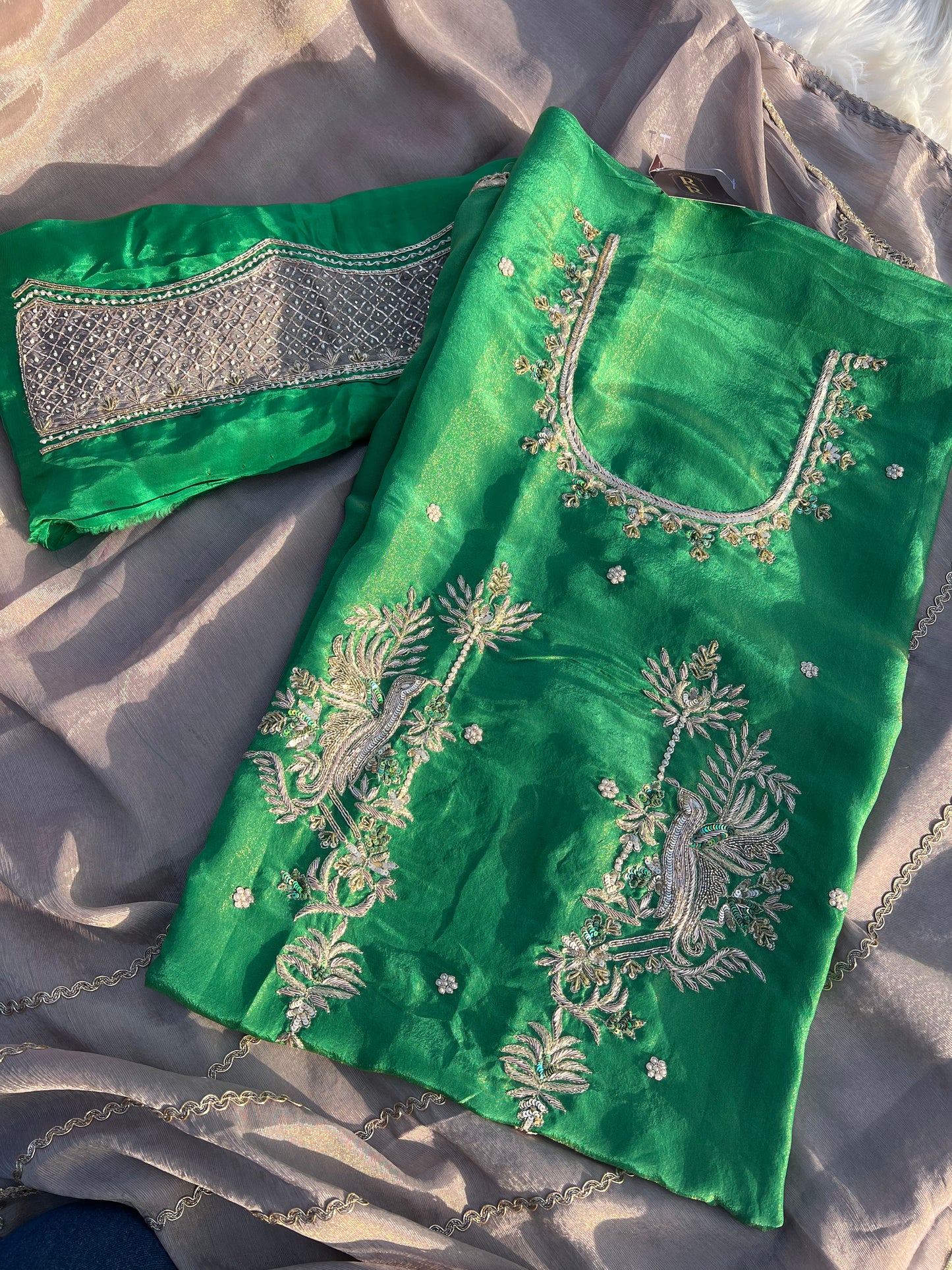 Hand-embroidered organza outfit with shimmering detail ideal for festive wear