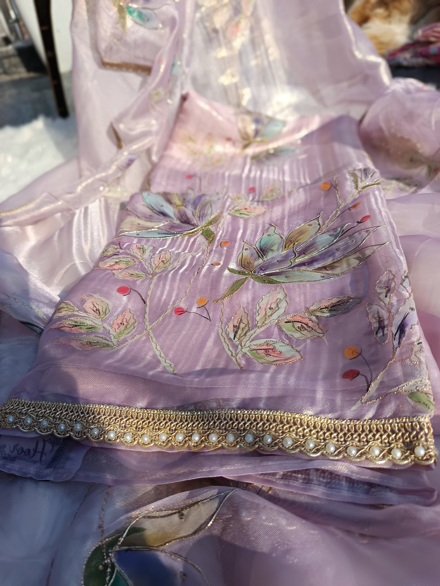 Traditional Chanderi suit with intricate handpainted floral patterns for timeless elegance.