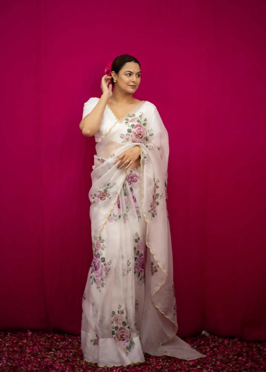 Elegant organza saree with vibrant floral prints, offering a perfect blend of style and grace for every occasion.