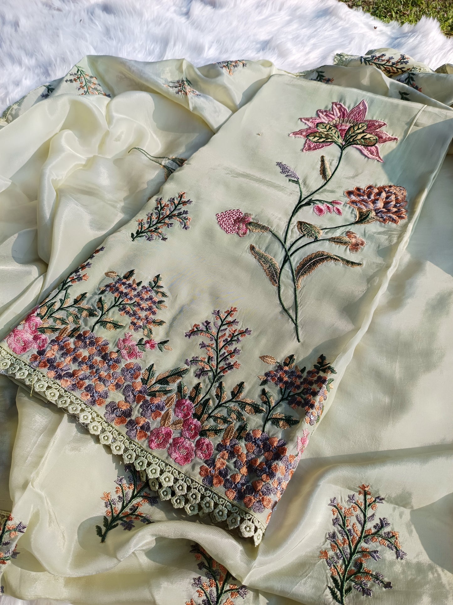 Flowing organza silk three-piece suit with coordinated dupatta and hand-finished embroidery