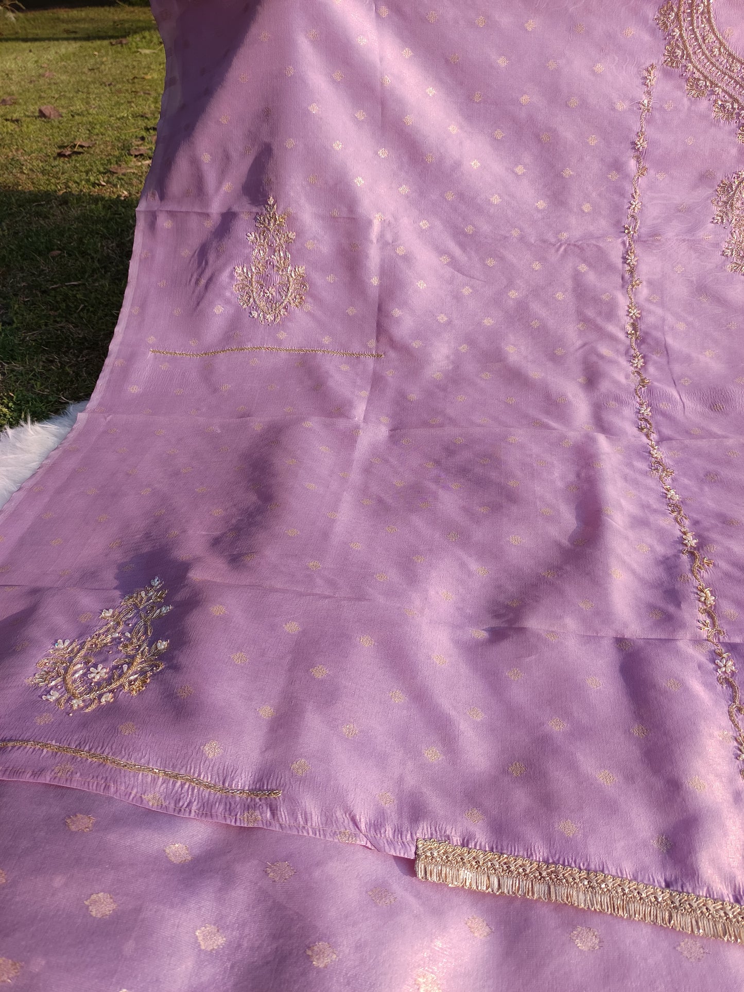Full-length visual of a pure tissue silk suit showcasing complete design and fall.