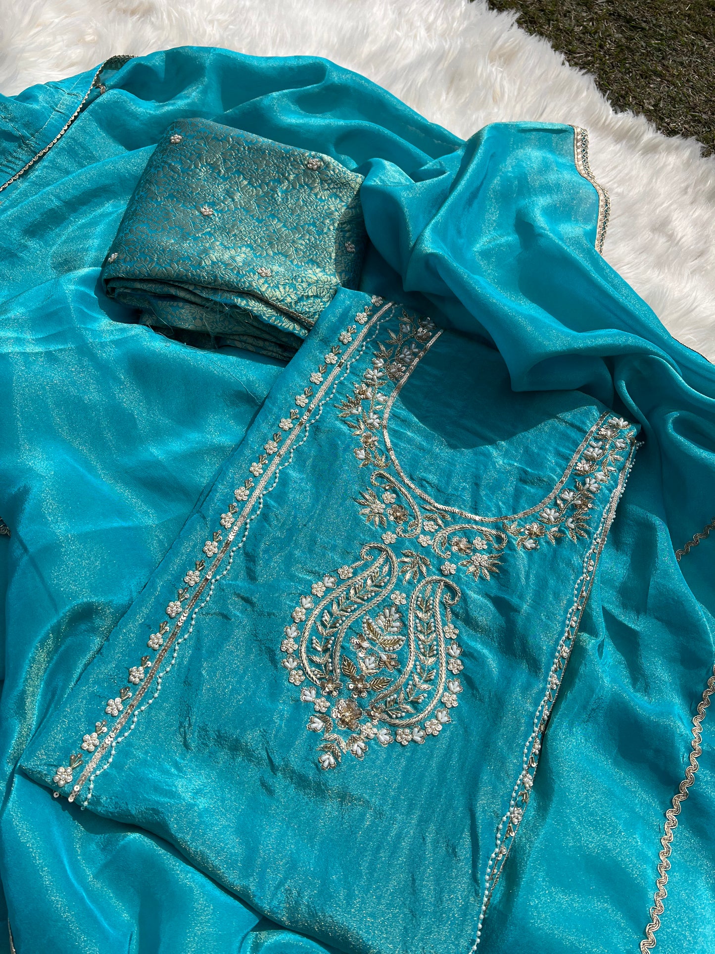 Golden dusk shaded organza drape with intricate handwork and ethereal shimmer