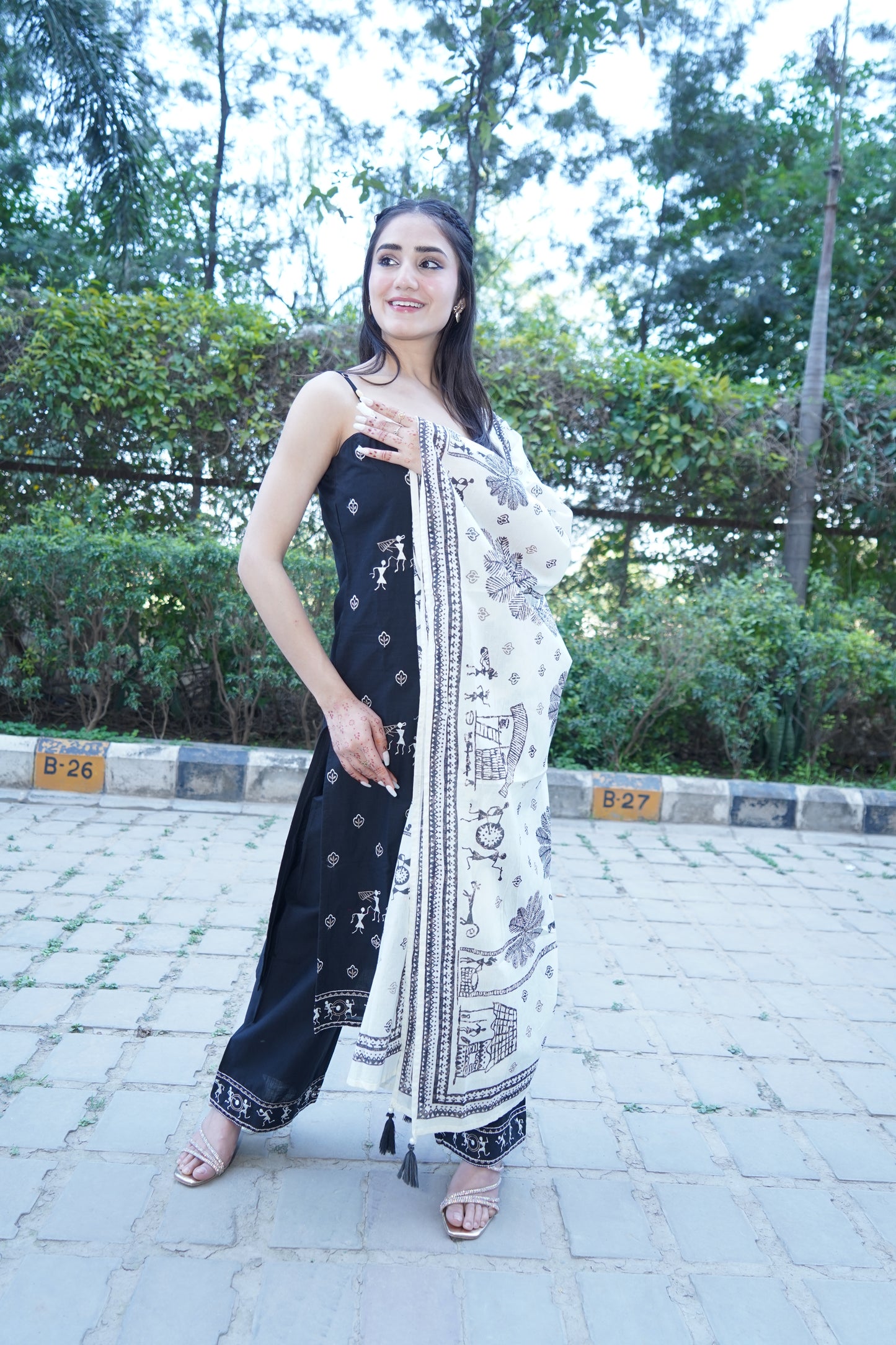 Graceful black embroidered straight suit from Shehnaaz collection.