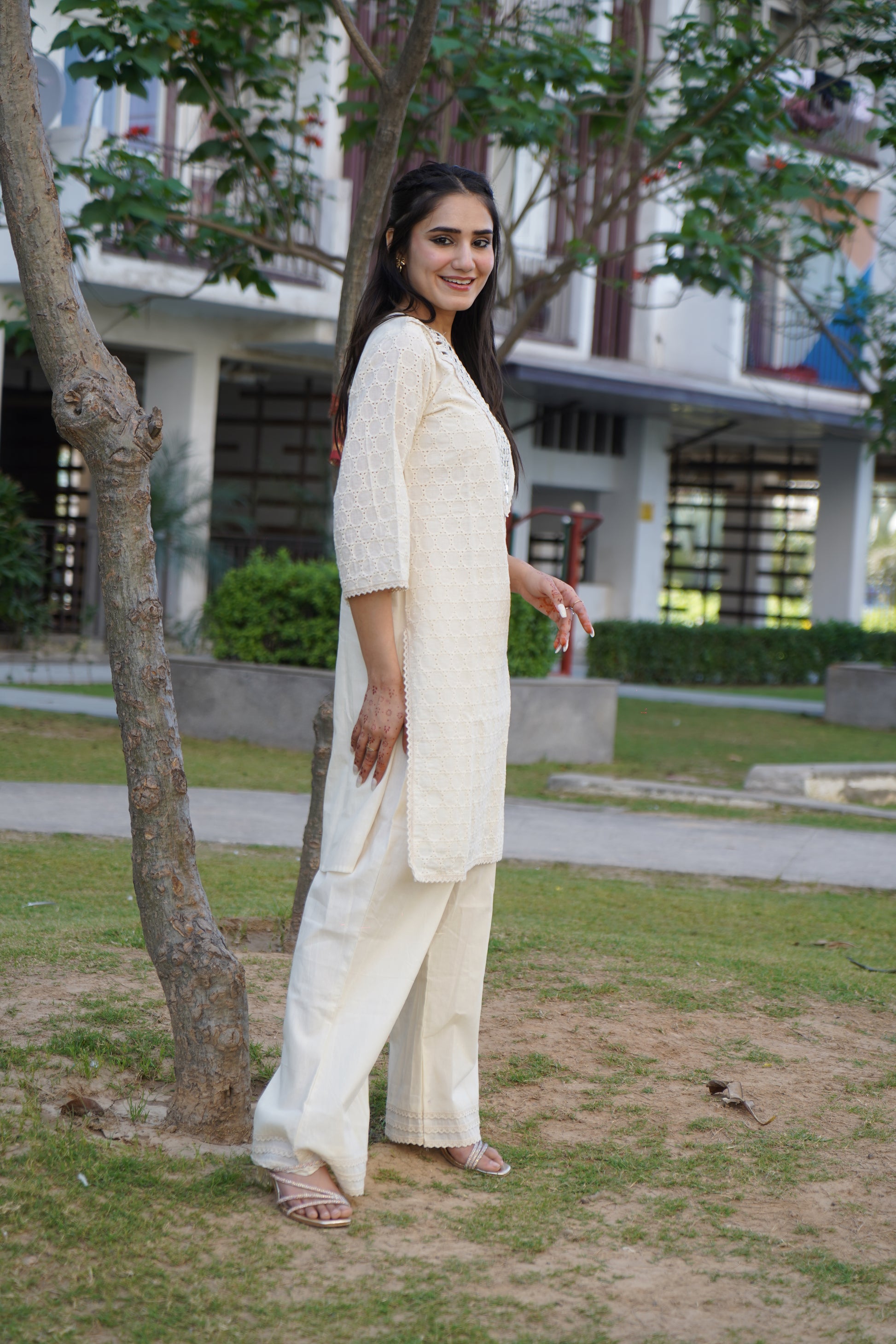 Graceful Noor off-white kurta set with silver stripe details