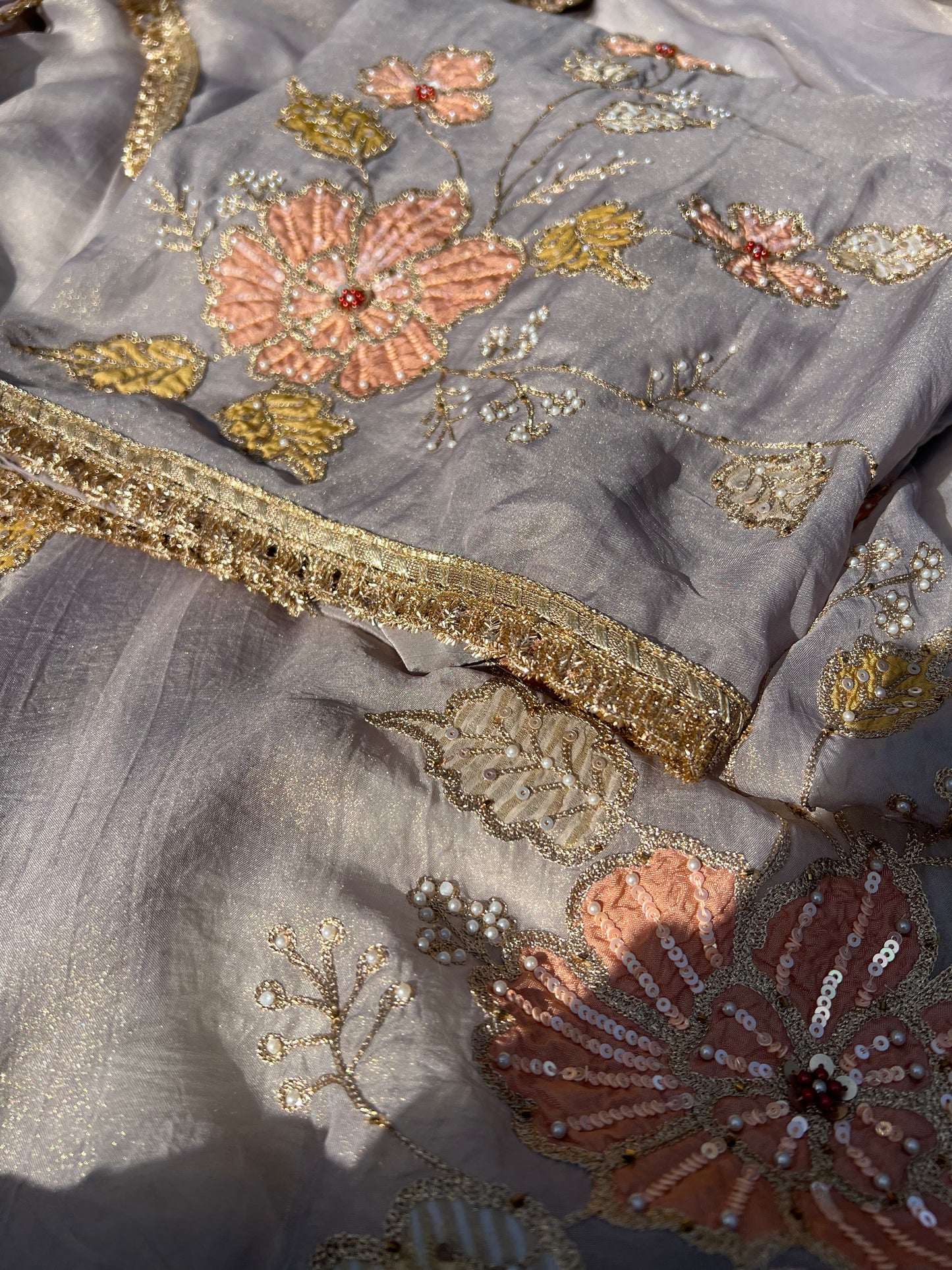 Close-up of grey silk dupatta with sheer organza fabric and subtle thread work