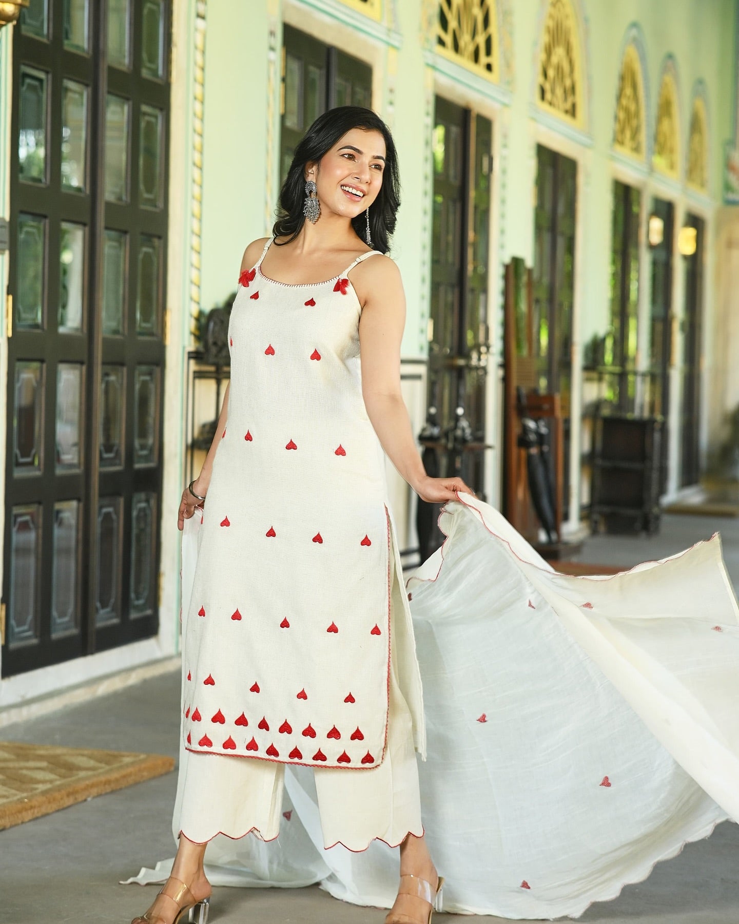 Ivory embroidered festive suit with fine detailing and coordinating dupatta