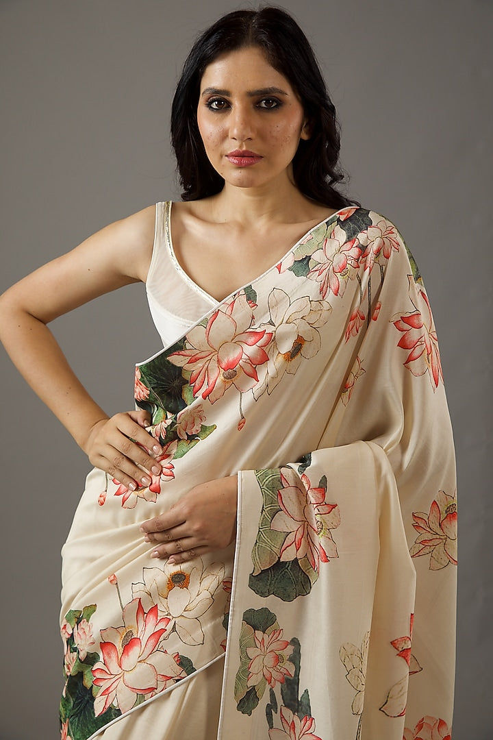 Ivory silk Chanderi saree with artistic prints, offering elegance and charm for special occasions.
