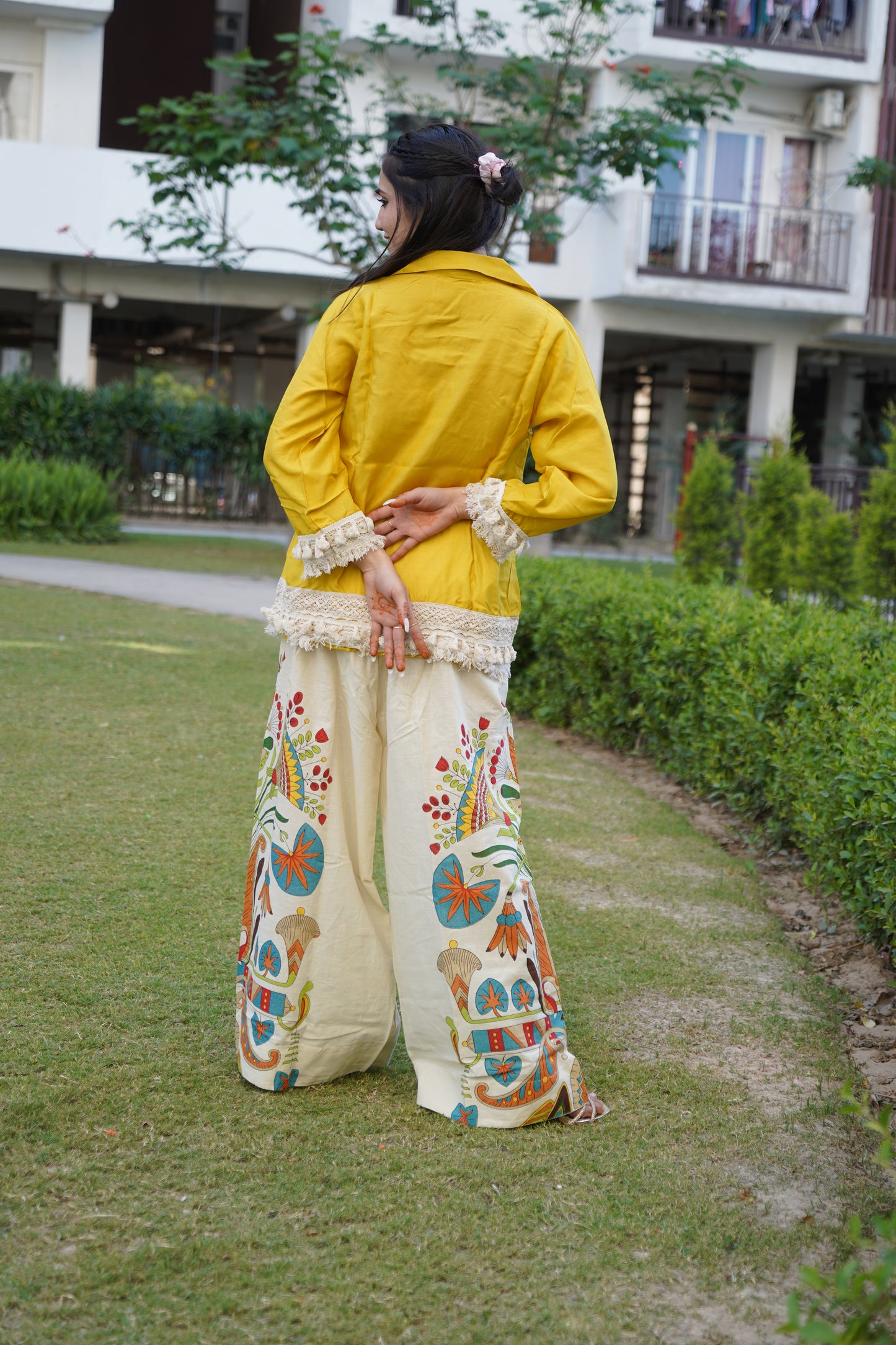 Modern yellow co-ord set with playful fringe accents