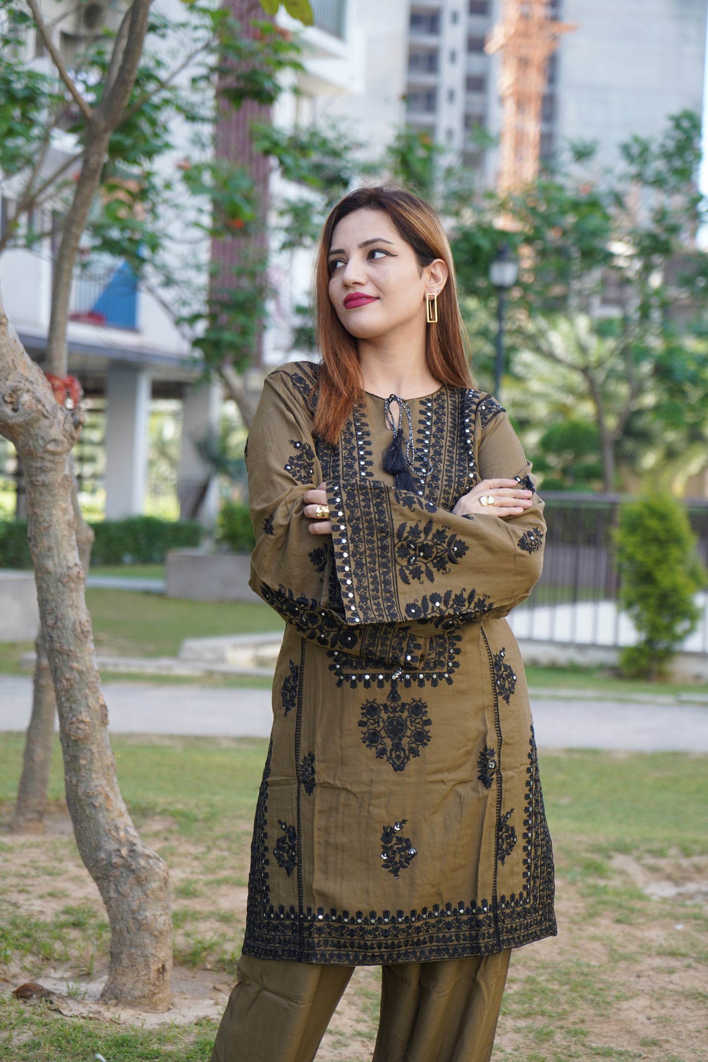 Modern olive green co-ord set with a sleek silhouette.
