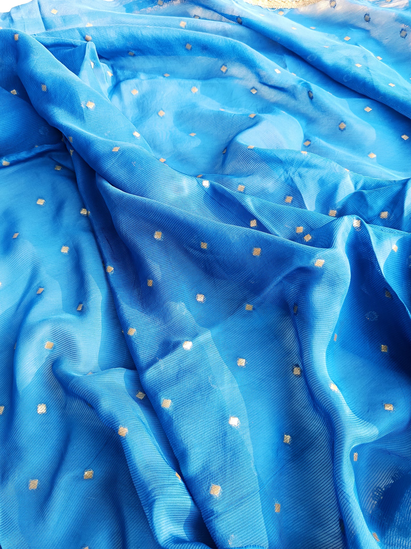 Handcrafted organza suit neatly displayed on a hanger to highlight its design.