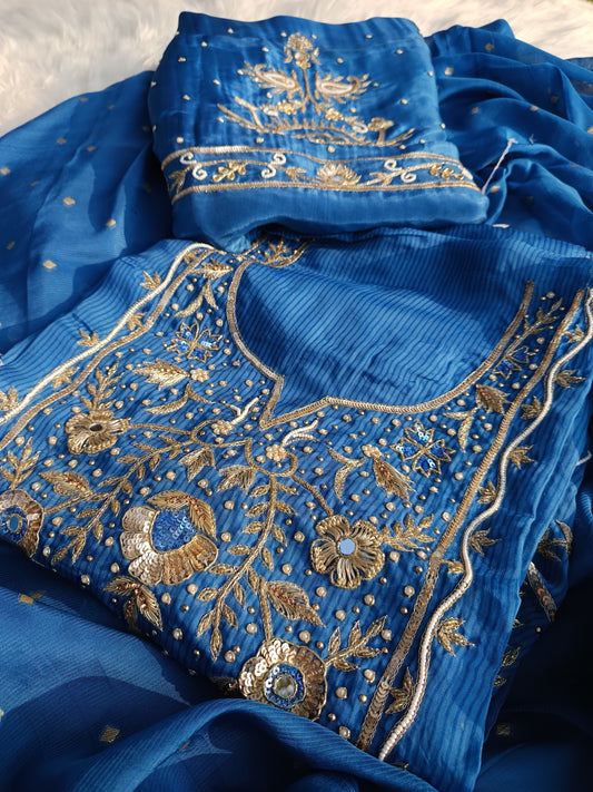 Organza handwork suit paired with matching dupatta featuring fine craftsmanship.