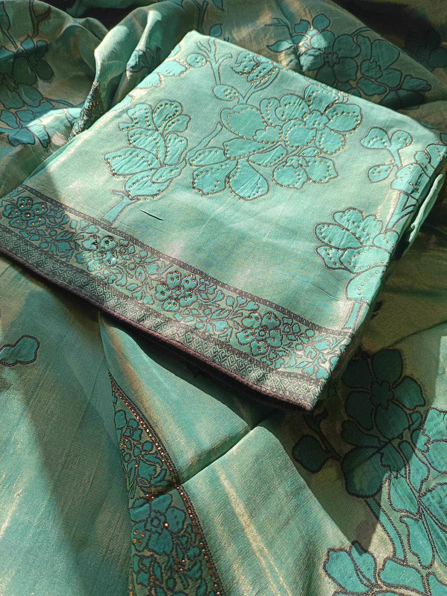Close-up of the Parsi Serosky suit fabric highlighting delicate handwork and serosky embellishments