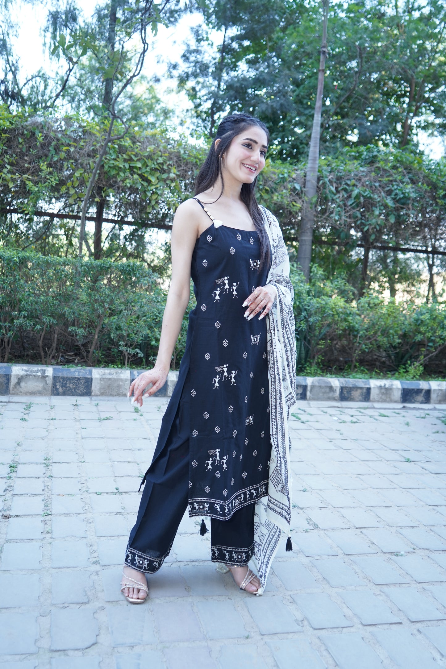 Premium Shehnaaz black straight suit with intricate embroidery.