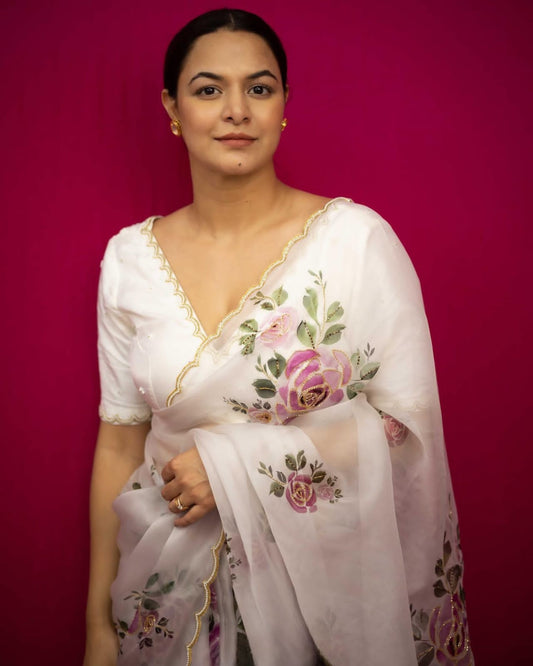 Stylish organza saree featuring bold floral prints, adding charm and sophistication to your wardrobe.