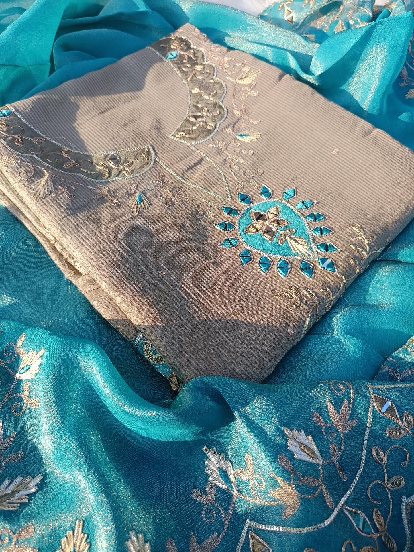 Close-up of delicate threadwork on the Pure Organza Silk Suit highlighting fine craftsmanship and fabric quality.