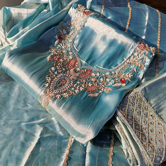 Woman showcasing the front design of a Pure Organza Silk Suit with intricate detailing