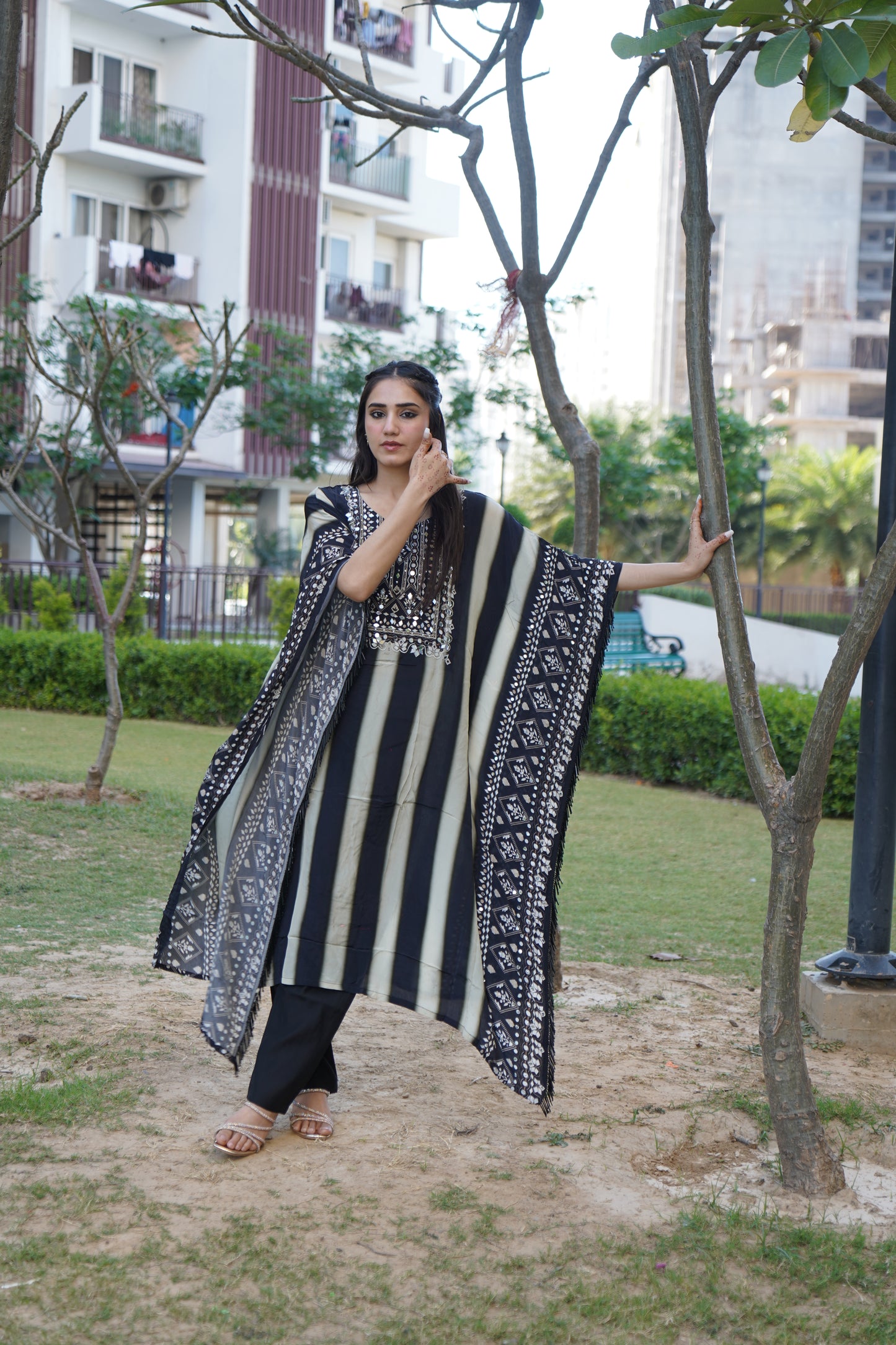 Festive Salma Sitara Kaftaan Set with intricate embellishments.
