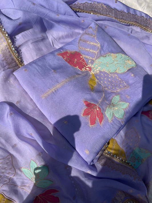 Sheer purple organza silk suit showcasing intricate craftsmanship