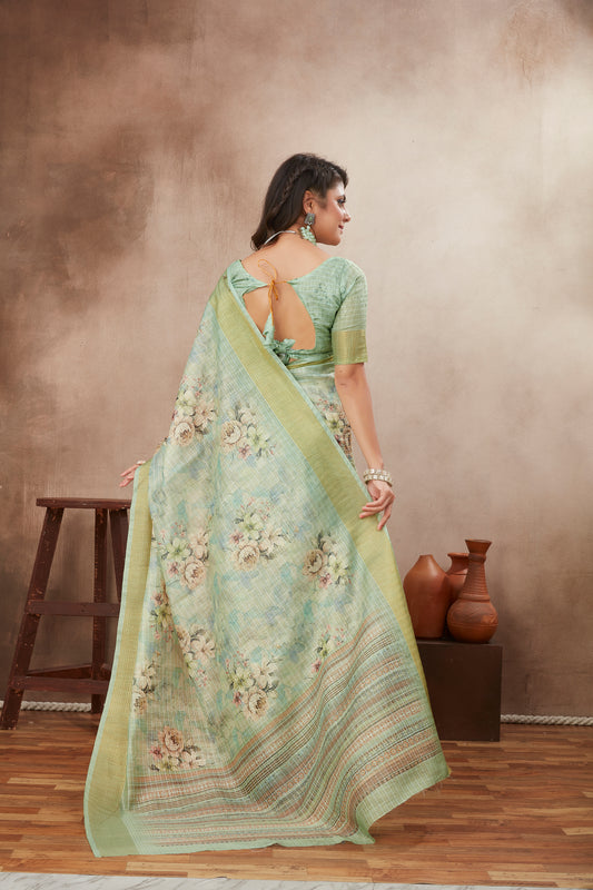 Woman draped in soft green ethnic saree with intricate border
