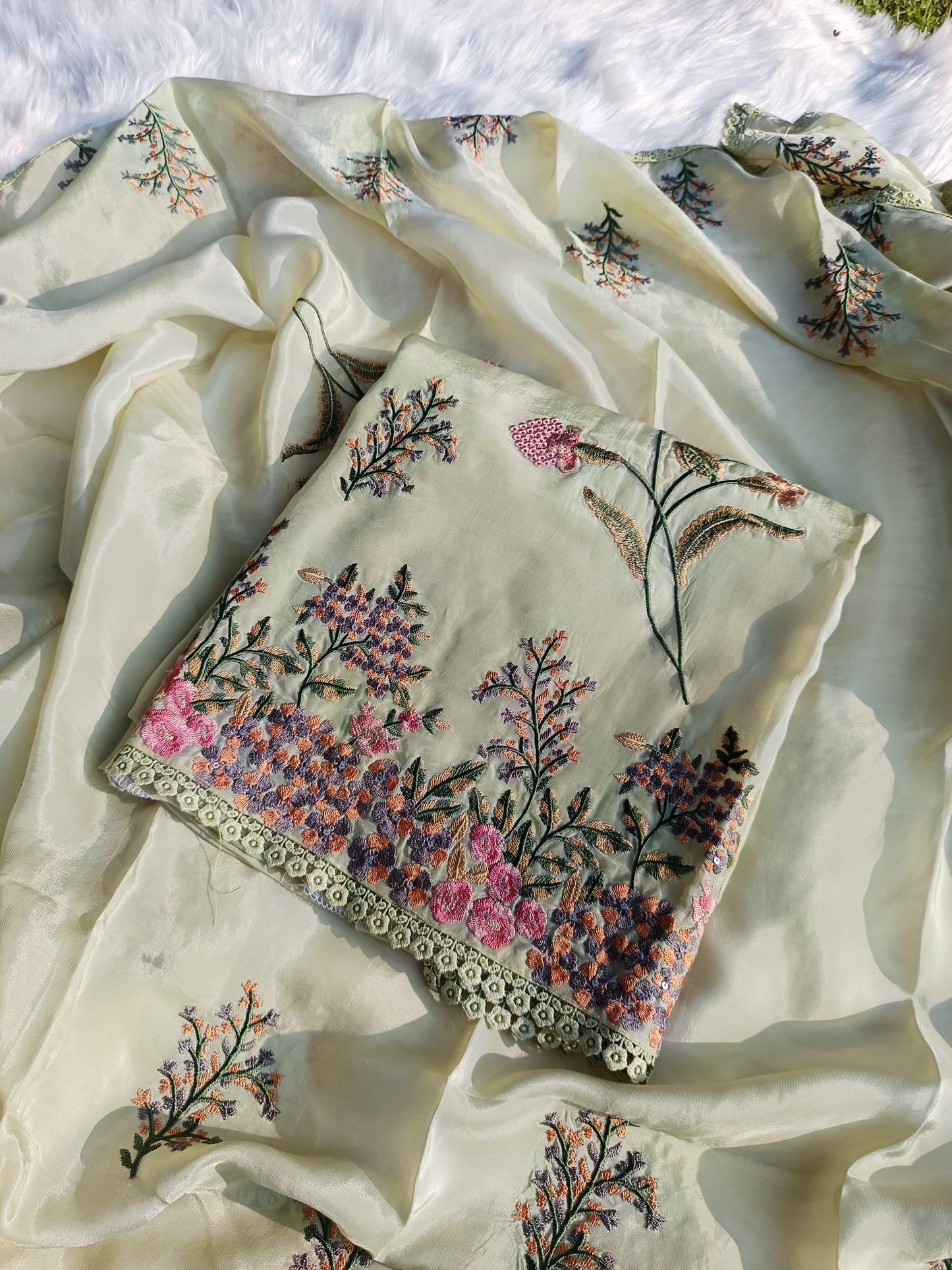 Soft pink organza silk suit with hand embroidery and sheer dupatta for a refined festive look