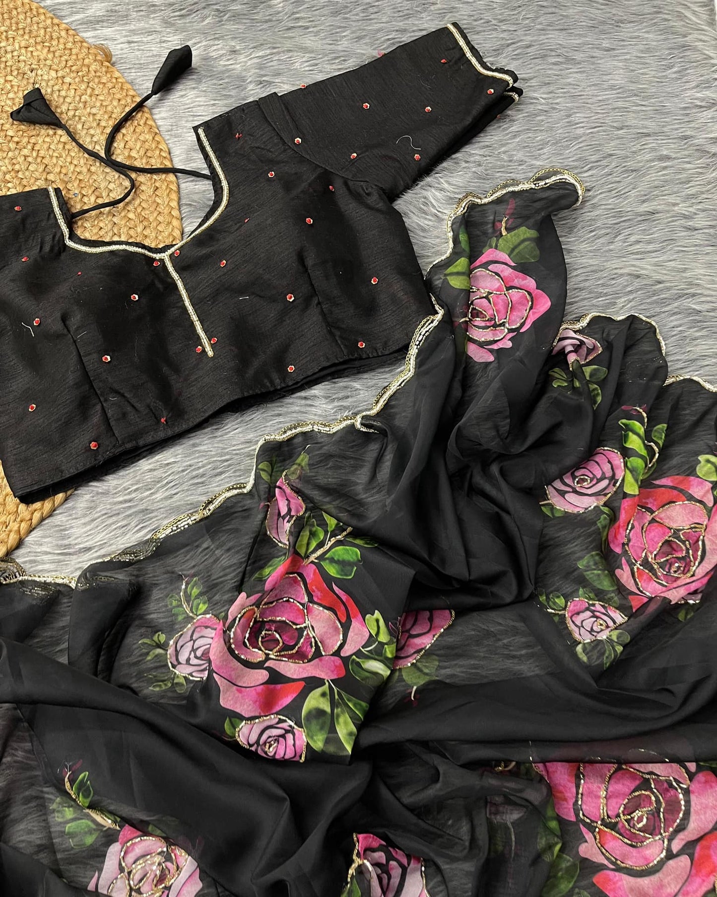 Delicate organza saree with elegant floral prints, offering a perfect blend of sophistication and lightweight comfort.