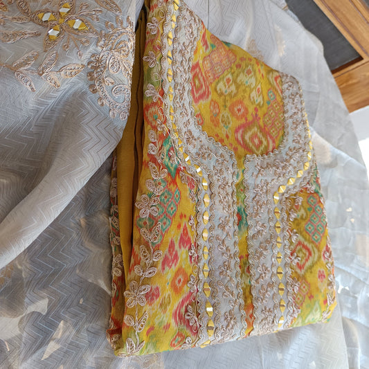 Trendy Printed Organza Salwar Suit, unstitched for a customized fit.