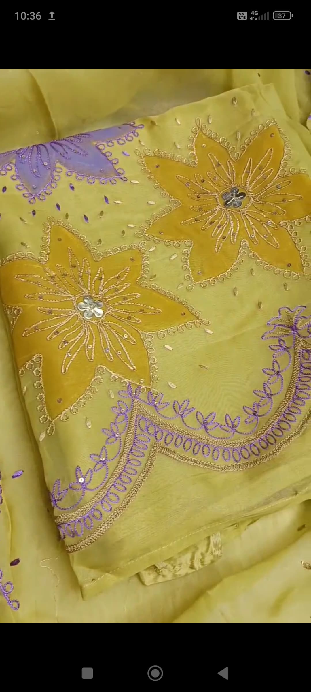 Unstitched organza dress material showcasing artisanal hand embroidery and subtle sheen