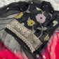 Full-length view of luxurious black Banarasi suit with classic ethnic design.