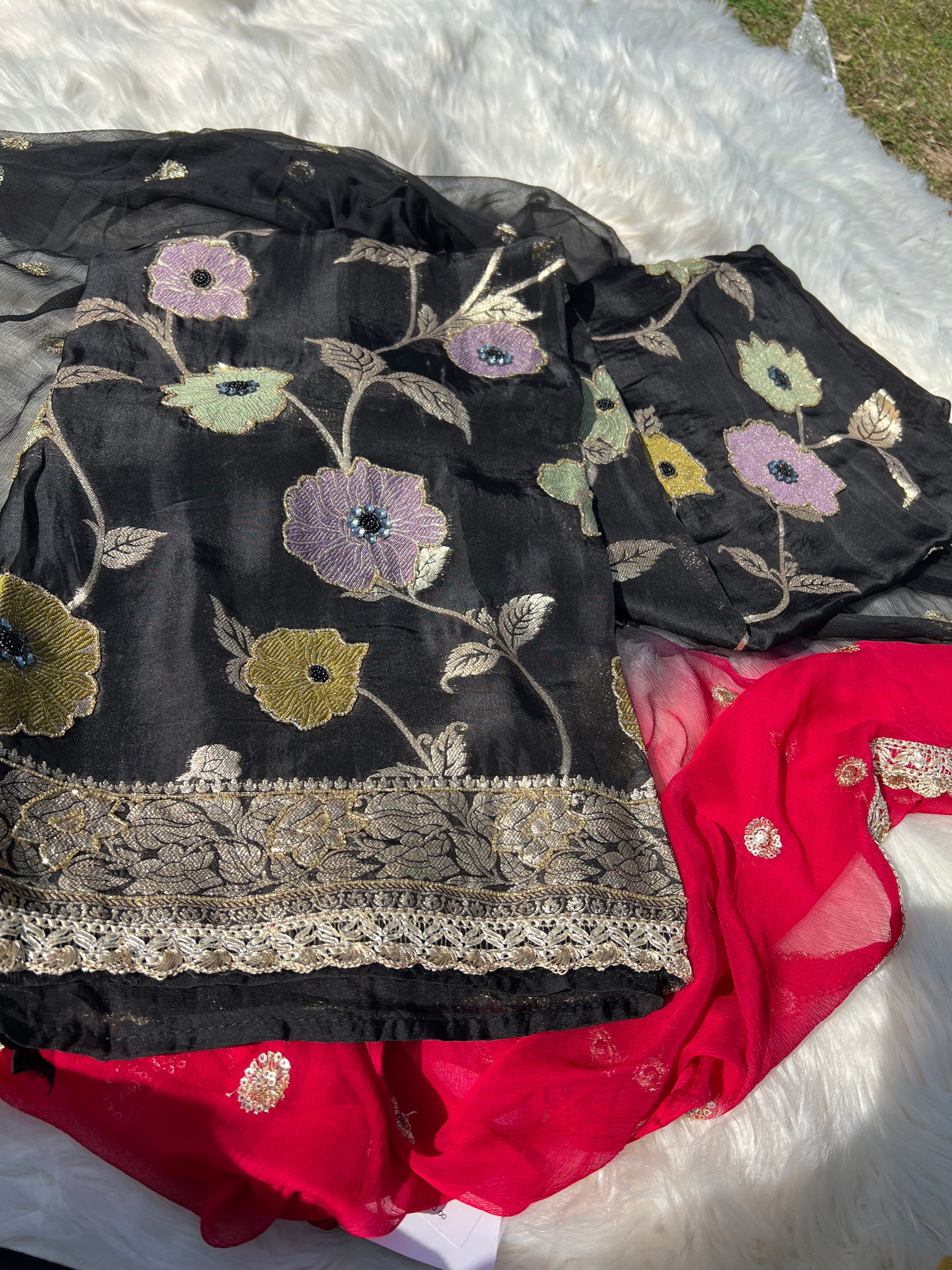 Soft and smooth georgette texture highlighted in the black Banarasi suit.