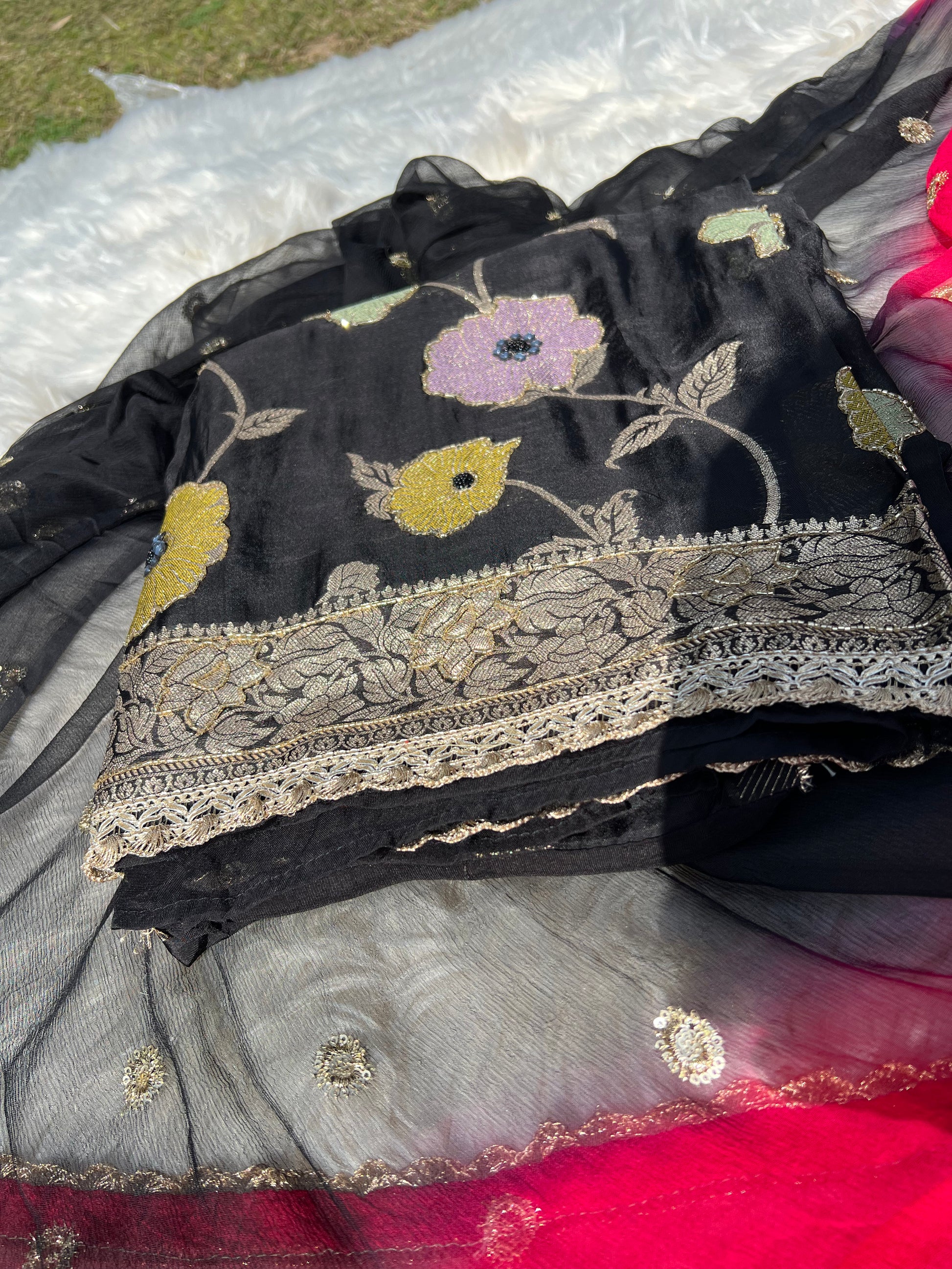Black Banarasi georgette suit paired with an elegantly woven dupatta.