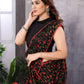 Charming black and red Georgette saree featuring modern prints and an unstitched blouse for a personalized fit.