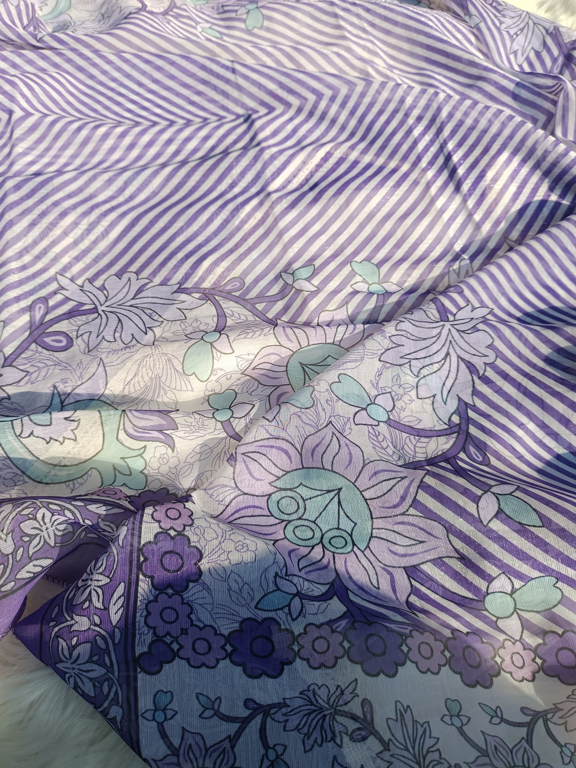 Border and hem detailing featuring small pearls on soft georgette