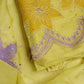 Close-up of delicate threadwork on premium organza fabric with detailed hand embroidery