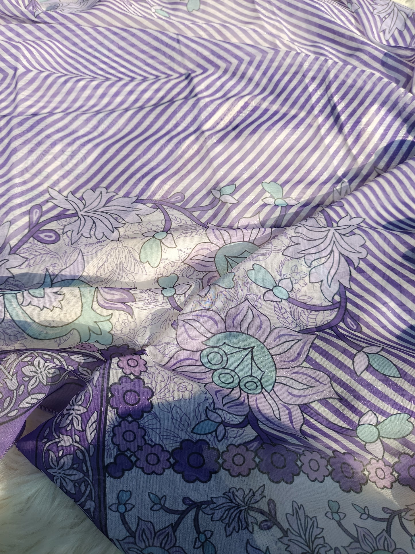 Flatlay of pearl work suit showcasing kurta, pants, and dupatta set