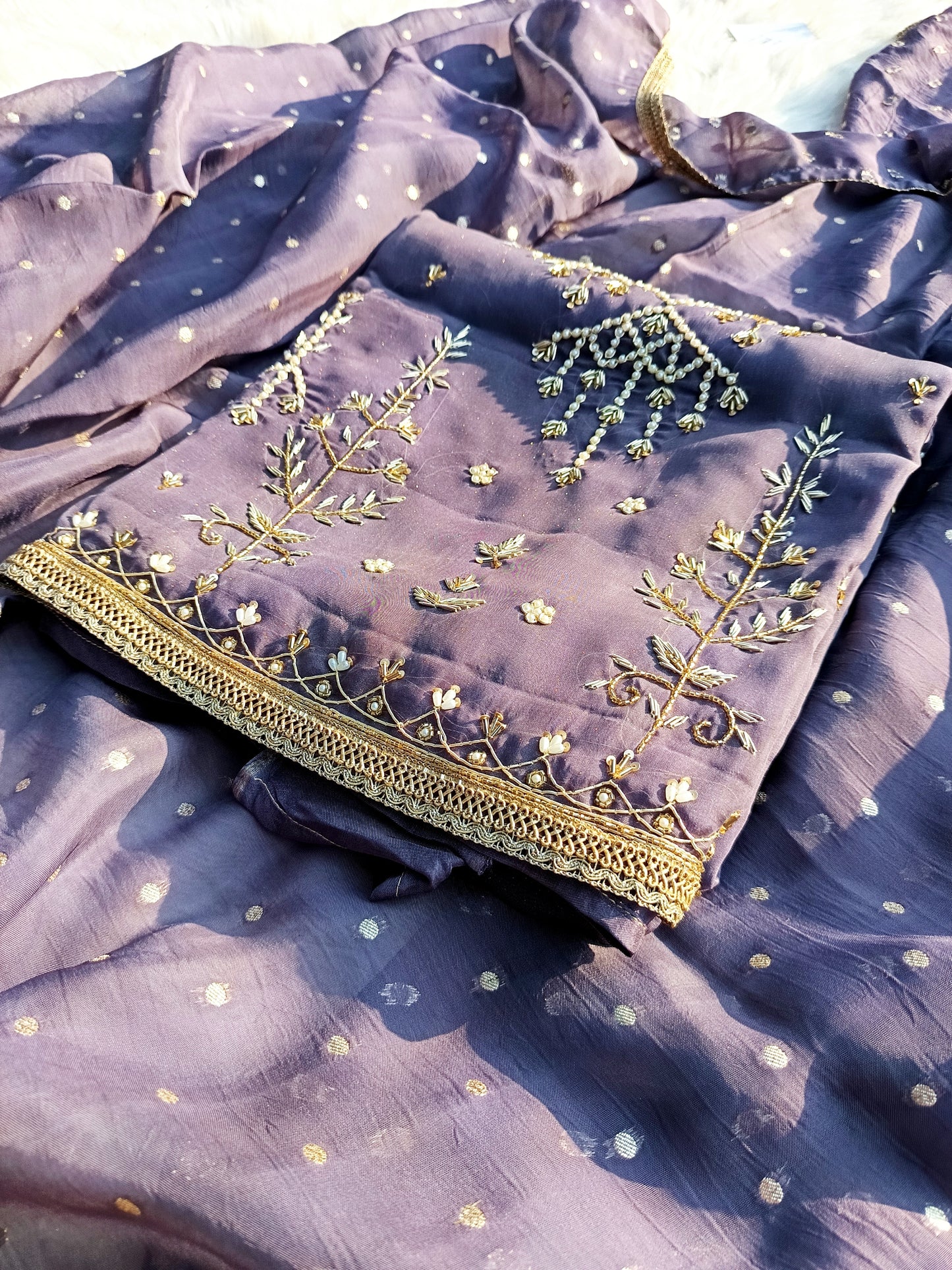 Close-up of the intricately handworked bodice on the Shimmer Organza Suit showcasing fine detailing.
