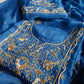 Closeup of hand embroidery and delicate detailing on organza fabric.