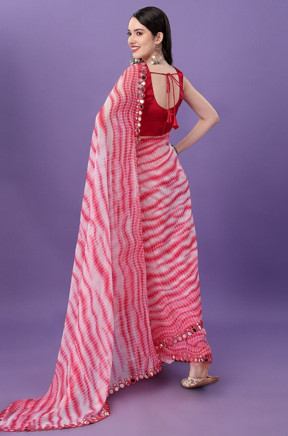 Stylish pink georgette saree with intricate Leheria prints for festive elegance.