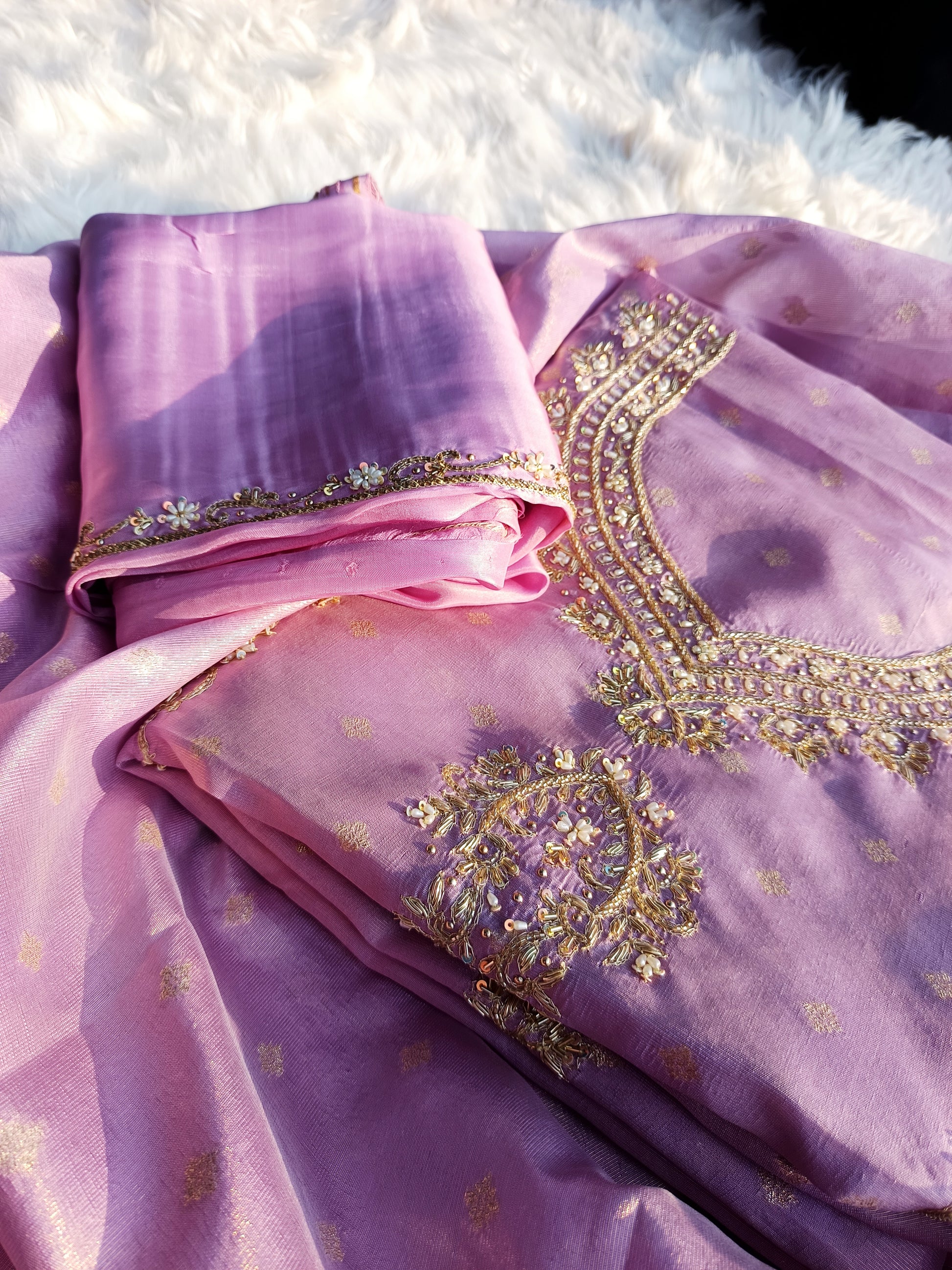  Elegant handwork suit made from tissue silk, paired with coordinated dupatta.