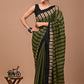 A lightweight cotton mulmul saree featuring exclusive prints, complemented by a coordinating blouse for a refined and elegant look.