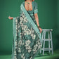 Stylish saree with vibrant floral prints and a matching blouse piece, ideal for festive or casual styling.