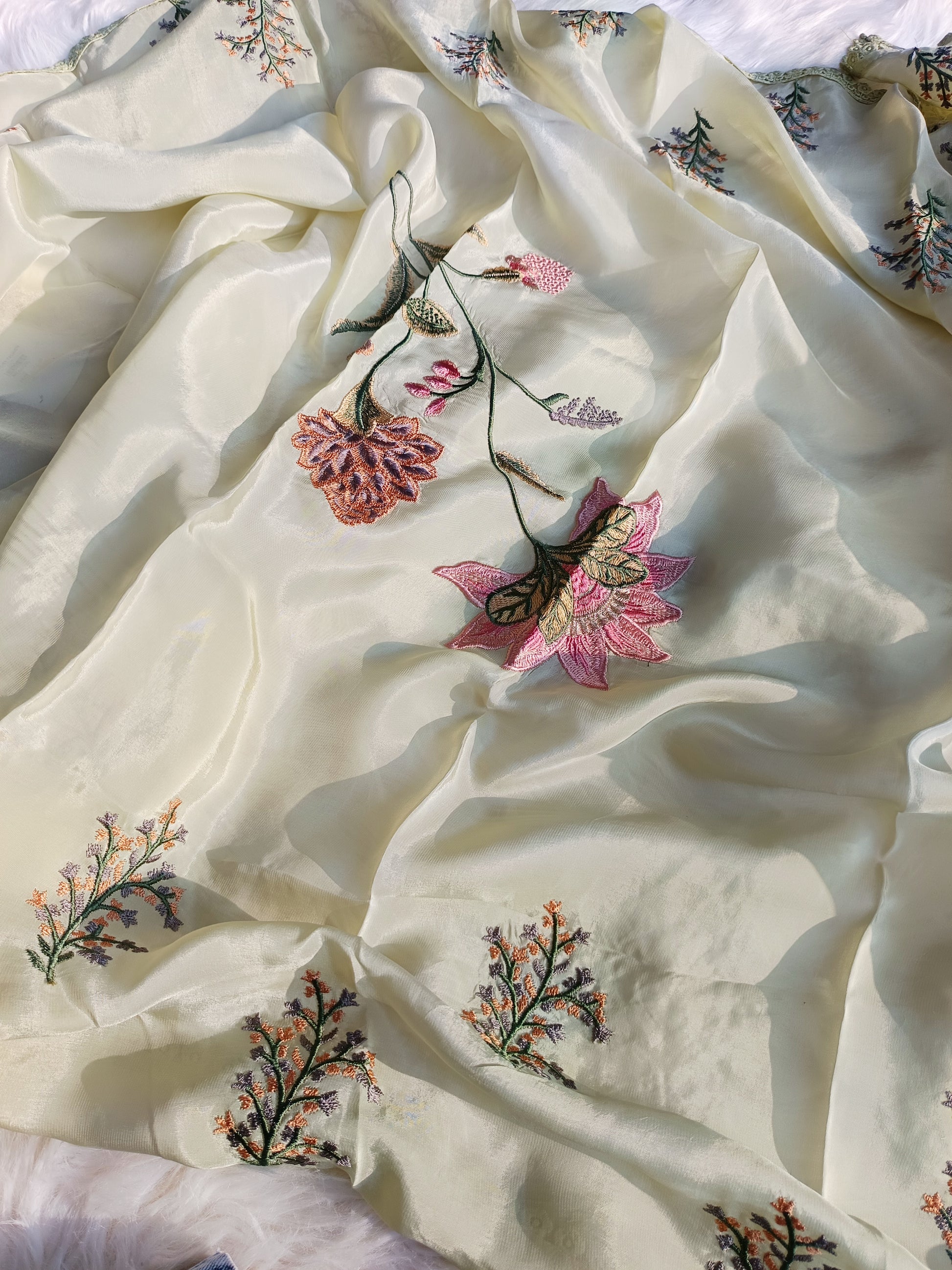  Full-sleeve organza silk suit showcasing fine embroidery and graceful fabric drape