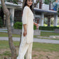 Graceful Noor off-white kurta set with silver stripe details