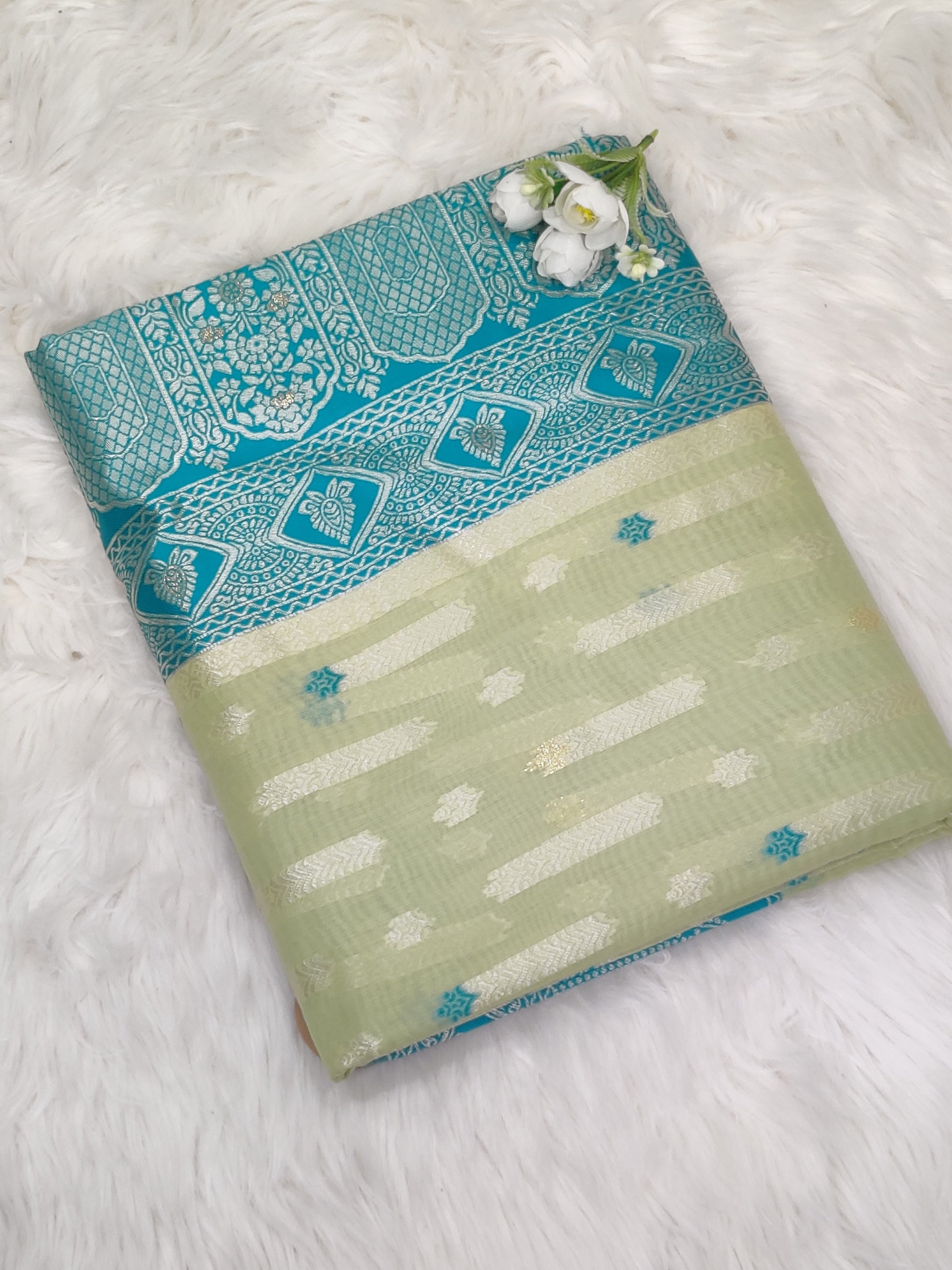 Green and blue-toned Organza Banarasi Saree featuring an exquisite woven design, crafted by RedRuby Fashion for a sophisticated look.